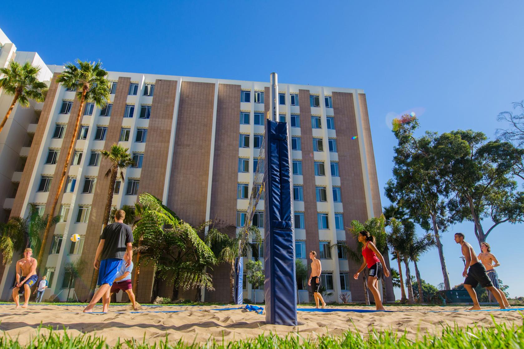 students playing volleyball outside San Nicolas residence hall